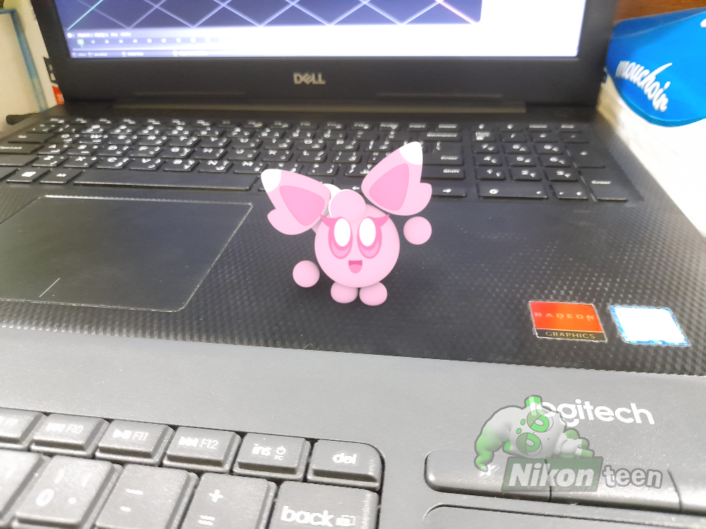 A Puff is standing on the laptop, waving to the viewer. For kirbyzaz